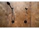 Modern shower with dual shower heads and beautiful travertine tile at 111 Carter Ln, Canton, GA 30115