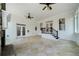 Sunroom featuring tiled floor, fireplace, and access to the deck at 111 Carter Ln, Canton, GA 30115