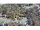 Aerial view of a home with a well-manicured lawn and mature trees in a quiet neighborhood at 1915 Turtle Creek Way, Lawrenceville, GA 30043