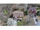 Aerial view of a home with a well-manicured lawn and a two-car garage at 1915 Turtle Creek Way, Lawrenceville, GA 30043