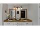 Bright bathroom featuring double sinks, framed mirrors, and a tiled floor at 1915 Turtle Creek Way, Lawrenceville, GA 30043