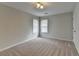 Bedroom with neutral walls, carpet flooring, natural lighting and new blinds at 1915 Turtle Creek Way, Lawrenceville, GA 30043