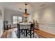 Elegant dining room featuring hardwood floors, crown molding, and a stylish chandelier at 1915 Turtle Creek Way, Lawrenceville, GA 30043