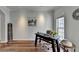 Cozy living area with hardwood floors, neutral paint, and a bright window at 1915 Turtle Creek Way, Lawrenceville, GA 30043