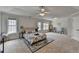 Spacious main bedroom featuring plush carpeting, tray ceiling, and plenty of natural light at 1915 Turtle Creek Way, Lawrenceville, GA 30043