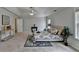Bright main bedroom featuring carpet, neutral walls, and tray ceilings at 1915 Turtle Creek Way, Lawrenceville, GA 30043