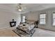 Comfortable main bedroom with tray ceilings and windows offering natural light and neutral walls at 1915 Turtle Creek Way, Lawrenceville, GA 30043