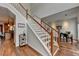 Open staircase leading to the second floor, complemented by hardwood floors and fresh paint at 1915 Turtle Creek Way, Lawrenceville, GA 30043