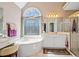 Elegant bathroom with a soaking tub, a large window, and a vanity at 918 Fox Hollow Way, Marietta, GA 30068