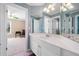 Spacious bathroom features a sink with ample counterspace, a large mirror, and natural light at 918 Fox Hollow Way, Marietta, GA 30068