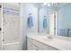 Bright bathroom with a bathtub, shower, and vanity with a large mirror at 918 Fox Hollow Way, Marietta, GA 30068