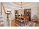 Cozy dining area with hardwood floors, elegant lighting, and decorative china cabinet at 918 Fox Hollow Way, Marietta, GA 30068
