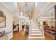 Open foyer featuring a grand staircase and beautiful hardwood floors at 918 Fox Hollow Way, Marietta, GA 30068
