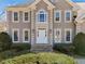 Elegant two-story home entrance with stone steps and meticulous landscaping at 918 Fox Hollow Way, Marietta, GA 30068