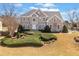 Charming two-story home with landscaped yard, gray stucco, and decorative windows at 918 Fox Hollow Way, Marietta, GA 30068