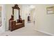Hallway with an antique mirror dresser and a view of another room via an arched window at 918 Fox Hollow Way, Marietta, GA 30068