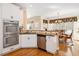 Bright kitchen featuring stainless steel appliances, granite countertops, and eat-in dining area at 918 Fox Hollow Way, Marietta, GA 30068