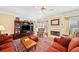 Inviting living room with a fireplace, classic furniture, and a ceiling fan at 918 Fox Hollow Way, Marietta, GA 30068