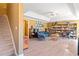 Spacious living room with laminate floors, bright colors, and a unique tray ceiling with fan at 918 Fox Hollow Way, Marietta, GA 30068