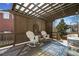 Charming covered patio with wicker furniture, perfect for outdoor relaxation and entertaining at 918 Fox Hollow Way, Marietta, GA 30068
