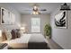 Virtually staged bedroom featuring neutral walls, carpet and contemporary art at 966 Westmoreland Nw Cir, Atlanta, GA 30318