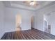Bedroom featuring a ceiling fan, wood floors and access to ensuite bathroom at 966 Westmoreland Nw Cir, Atlanta, GA 30318