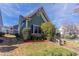 Angle view of a house with well-maintained landscaping with trees, bushes, and a brick walkway at 966 Westmoreland Nw Cir, Atlanta, GA 30318