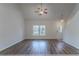 Bright living room featuring dark wood floors, large windows, and neutral walls at 966 Westmoreland Nw Cir, Atlanta, GA 30318