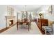 Elegant dining room with hardwood floors, fireplace and ornate light fixture at 160 Peachtree Ne Way, Atlanta, GA 30305