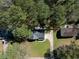 Aerial view of property featuring mature trees and a long driveway at 513 S Malton Ct, Stone Mountain, GA 30083
