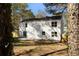 Beautiful two-story home boasts a spacious backyard with a fence and patio area at 513 S Malton Ct, Stone Mountain, GA 30083