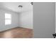 A well-lit bedroom showcasing its light wood flooring, fresh paint, and natural light at 513 S Malton Ct, Stone Mountain, GA 30083