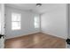 Clean bedroom with wood floors, two large windows, and fresh paint at 513 S Malton Ct, Stone Mountain, GA 30083