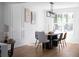 Dining room features modern chandelier, neutral colors and a large window at 513 S Malton Ct, Stone Mountain, GA 30083