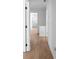 Hallway with light wood floor, fresh paint, and doors at 513 S Malton Ct, Stone Mountain, GA 30083