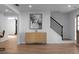 Open-concept living area features hardwood floors, staircase, and modern decor at 513 S Malton Ct, Stone Mountain, GA 30083