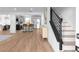Bright, open-concept space with stairs and a view to the modern kitchen at 513 S Malton Ct, Stone Mountain, GA 30083
