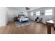 Large main bedroom featuring wood floors, sitting area, and ensuite bath at 513 S Malton Ct, Stone Mountain, GA 30083