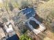 Aerial view of the backyard featuring a patio and kidney-bean-shaped swimming pool at 75 Price Dr, Locust Grove, GA 30248