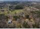 Areal view showing the house, barn, and yard at 75 Price Dr, Locust Grove, GA 30248