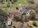 Expansive property featuring a pool, outbuilding, and winding driveway in a rural setting at 75 Price Dr, Locust Grove, GA 30248