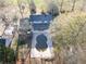 Overhead view of a large in-ground swimming pool with patio and screened-in porch at 75 Price Dr, Locust Grove, GA 30248