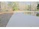 Spacious backyard showcasing a large pool and a shed, perfect for outdoor activities at 75 Price Dr, Locust Grove, GA 30248