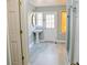 Bathroom showcasing a white pedestal sink, wood look floors and white door and trim at 75 Price Dr, Locust Grove, GA 30248