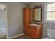 Bathroom featuring a wooden vanity with mirror at 75 Price Dr, Locust Grove, GA 30248