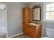 Bathroom featuring a wooden vanity with mirror at 75 Price Dr, Locust Grove, GA 30248