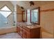 Cozy bathroom features tiled walls, shower and double sink vanity at 75 Price Dr, Locust Grove, GA 30248