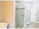 Shower room with glass doors, light gray walls, and wood look flooring at 75 Price Dr, Locust Grove, GA 30248
