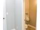Small half-bath with a toilet and urinal at 75 Price Dr, Locust Grove, GA 30248