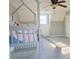 Bedroom area with a decorative bunk bed and slide at 75 Price Dr, Locust Grove, GA 30248